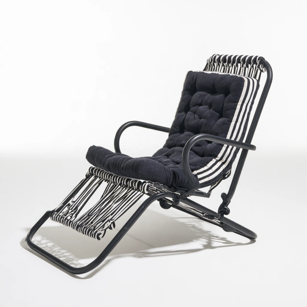 Jastira black and white folding recliner chair for living room, showcasing adjustable, modern design in a home setting.