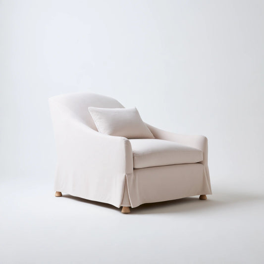 Jastira beige velvet accent armchair with textured upholstery, shown from a three-quarter angle, in a living room setting.