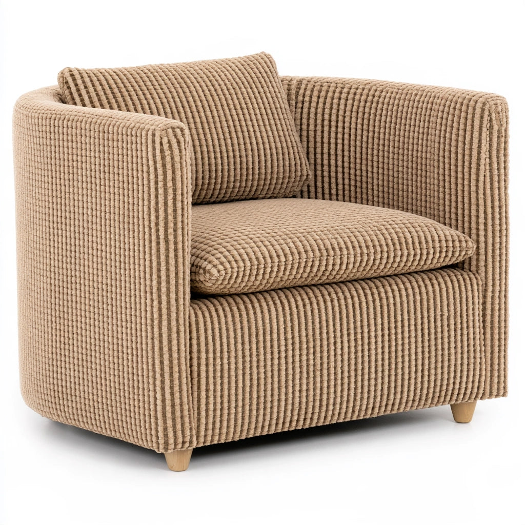 Jastira beige velvet accent barrel chair with textured upholstery, shown from a three-quarter angle for living room decor.